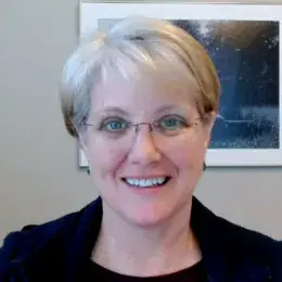 Professional portrait of an MGH IHP Doctor of Audiology faculty member in her office