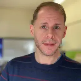 Tom Shull in striped shirt