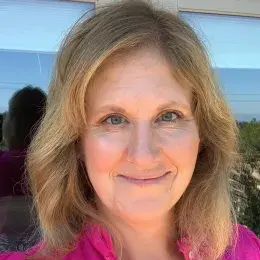 Carrie Mclean in pink shirt