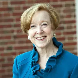 debbie wears a royal blue top with a ruffle