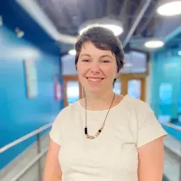 Kelly Spellman in white shirt