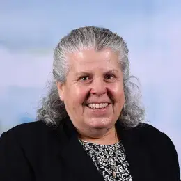 Professional headshot of an MGH IHP Doctor of Physical Therapy program faculty member with a studio background