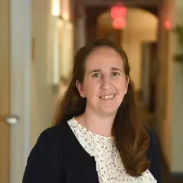 annie has dark hair and wears pink lip gloss