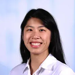 abby has straight black hair and a white collared shirt