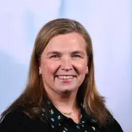 sara has light brown shoulder length hair parted on the side