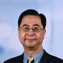 john wears oval glasses and a yellow tie