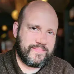 Joshua Hartshorne in brown sweater