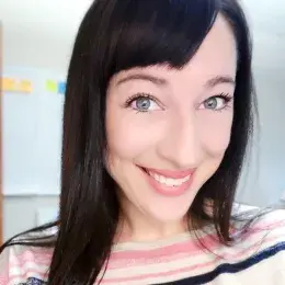 sarah has a pink and blue striped shirt and straight black hair