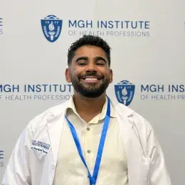 Jimaldy wears a white lab coat and has a beard and mustache