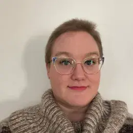 katie wears cat eye gold rimmed glasses