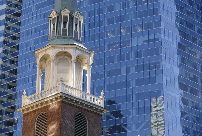 Historical building next to a skyscraper in Boston