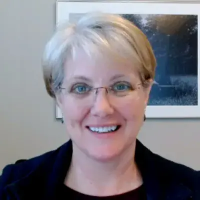 Professional portrait of an MGH IHP Doctor of Audiology faculty member in her office