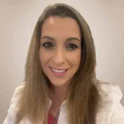 erin headshot she wears a white blazer