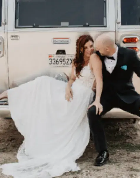 Sylvia Brandenberg and Dan McGuire celebrate their recent marriage at Grant Teton National Park in front of their Airstream trailer.