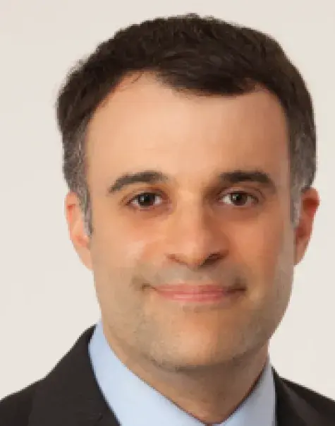 Dr. David Topor center of the image, with beige background.