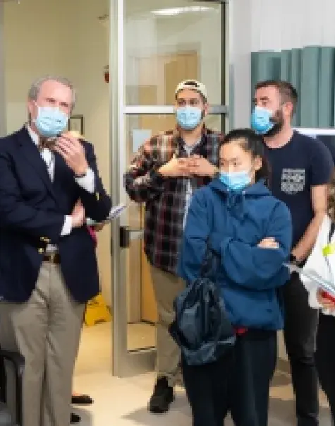 School of Nursing Dean Dr. Kenneth R. White, third from left, talks with students from the University of Richmond during their tour of the IHP campus.