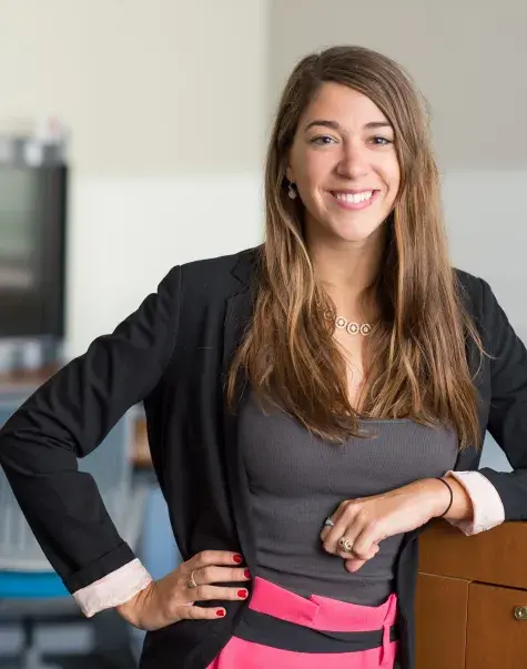 profile photo of sophie leaning on a desk