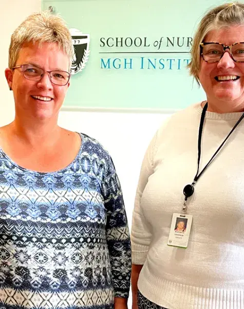 Photo of Writer Marian Hanso (left) traveled from Grenada to meet SON faculty member Mary Beth Coughlin.
