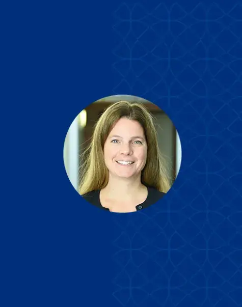 Photo of Cathy Schmidt on a blue background