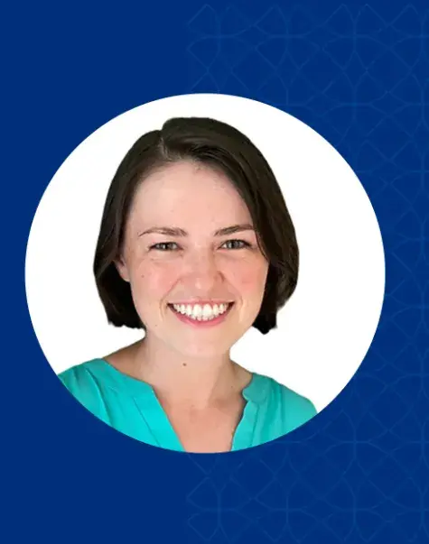 jenny has short dark hair and wears a teal top