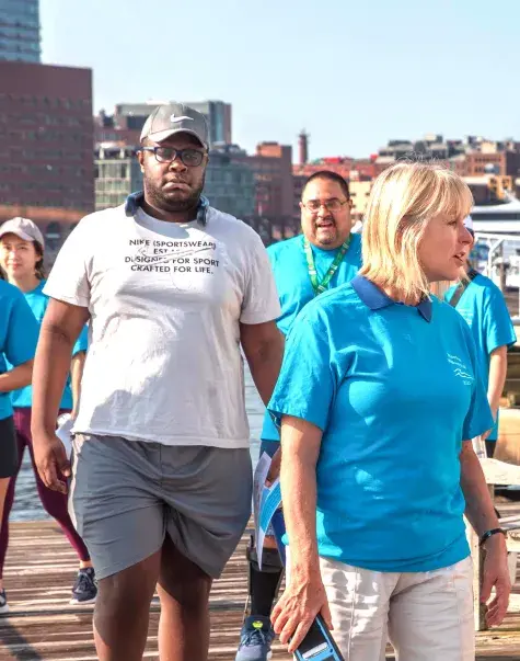 People walking on a pier