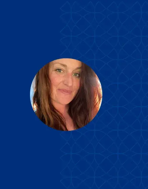 close up photo of norma the sun is shining through her red hair