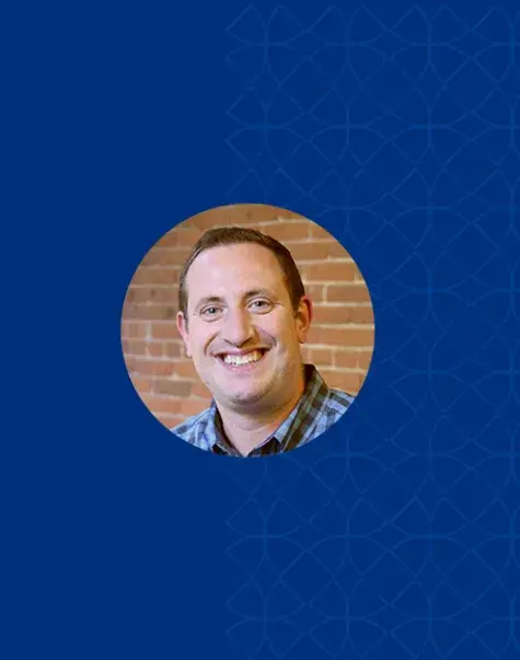 paul has a big smile and brown hair