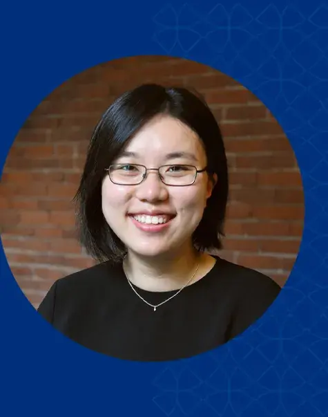 xue has straight black hair and rectangular glasses