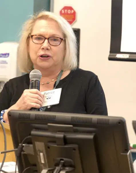 woman speaking at podium
