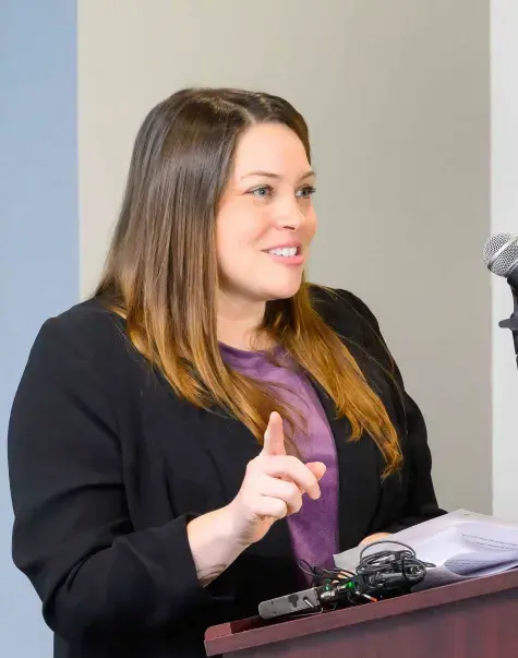Woman speaking at podium