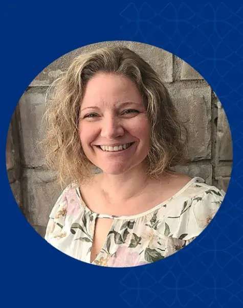 amy wears a flowered spring colored top