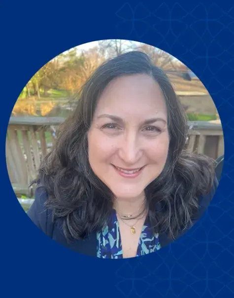 nicole is outside on a deck in the fall 