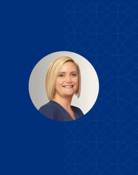 rosemary has short blond straight hair and a blue top