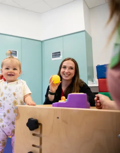 alumni mary odonnell and child in OT center 