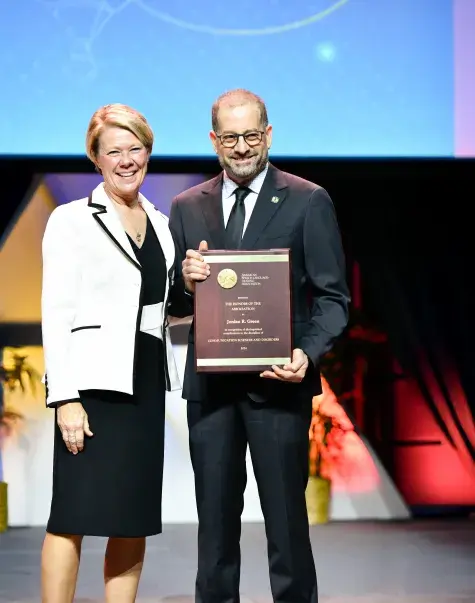 jordan green with his award