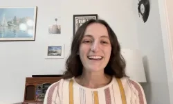 hope smiles as she chats with someone off screen